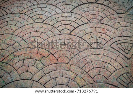 Abstract footpath tiles in fan shape background. The Stone pathway in the garden, textured in European fan shape.