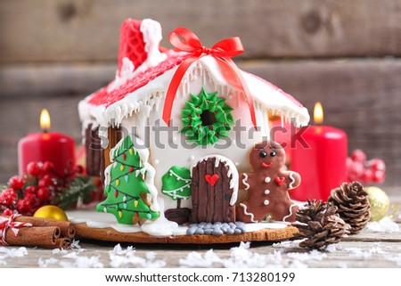 Christmas gingerbread house on grey wooden table