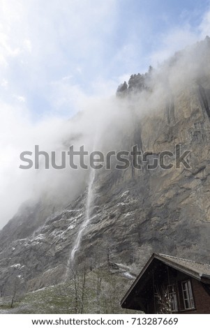 Famous Lauterbrunnen town and Staubbach waterfall Junfrau region Berner Oberland Switzerland