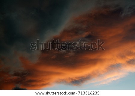 Close up picture of a beautiful cloud sky with orange and gray. after a thunderstorm
