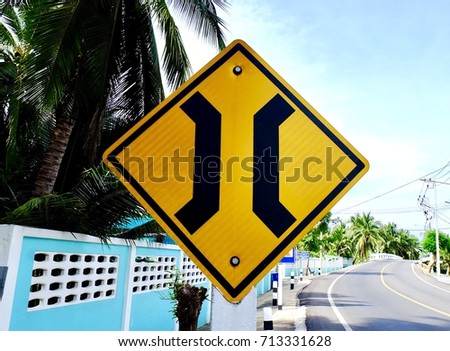 Traffic sign "Narrow Bridge" in side road.