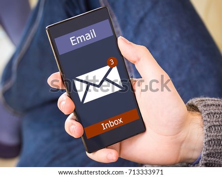 The man received an e-mail online on a mobile phone. Message online icon.