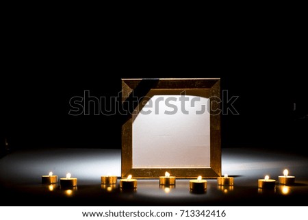 Blank mourning frame for sympathy card on dark background
