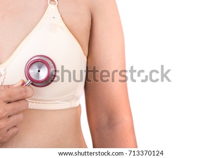 Breast Cancer concept : Woman holding Stethoscope for checking her breast isolated on white background