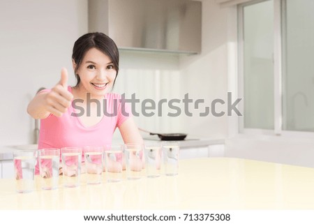 woman drink water with health concept in the kitchen