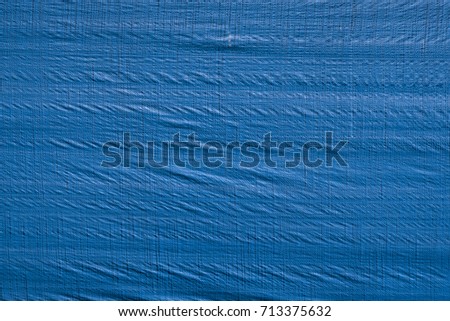 Wrinkled blue tarp texture Royalty-Free Stock Photo #713375632