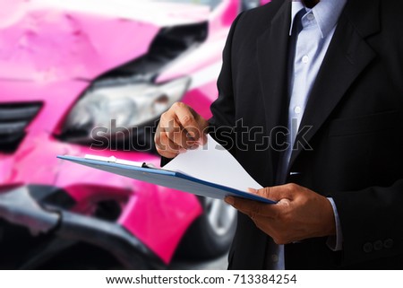 Car insurance agents open clipboard as a proof of insurance claim for taxi car accident damaged 