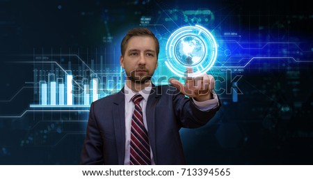 Young businessman working on digital screen in futuristic virtual office. Modern business concept.