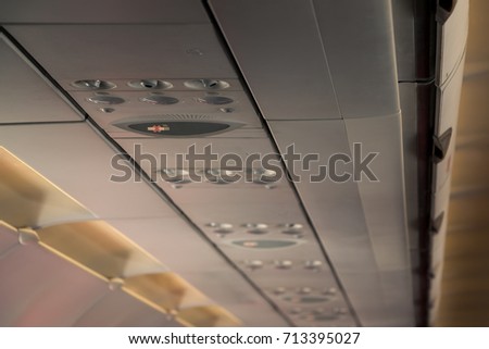 Security on a plane / Fasten Seat belt sign  / No Smoking sign on a plane