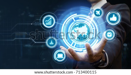 Young businessman presenting new technologies in his virtual office. Futuristic background. Modern business concept. Copy space for your text and logo.