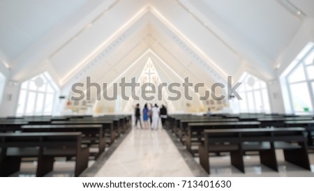 The blurred picture is the public church in Thailand. The picture concepts are church, architecture, thanksgiving, christian.