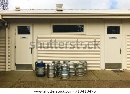Umpires and visitors club rooms at local football club. With beer barrels.