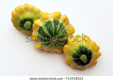Yellow flying saucer squash on white background