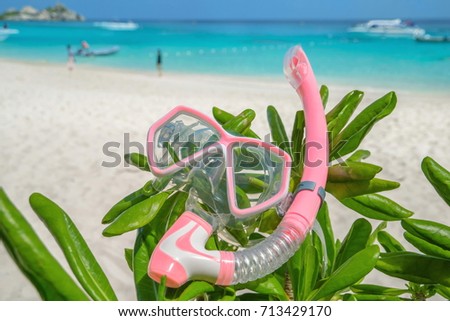 The snorkel is located on the beautiful white beach of Similan Island in Thailand.Summer sea travel.Summer beach travel.