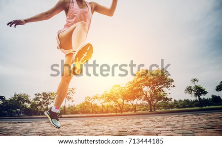 Athletic Woman Running in the Park at Morning Time Sport and Recreation Concept