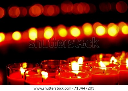 Incense stick aroma candles fire light in buddhist temple peace pray faith lucky blurred bokeh background