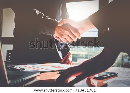 Successful businessmen partnership handshaking after acquisition. Ceremony Meeting and Group support concept. Royalty-Free Stock Photo #713451781