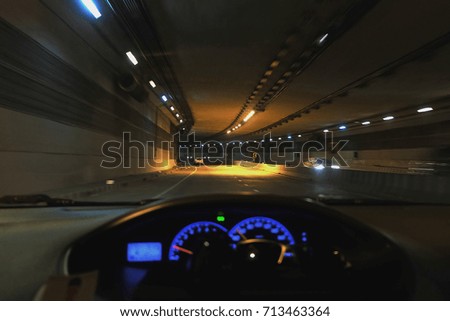 Car driving into the tunnel.