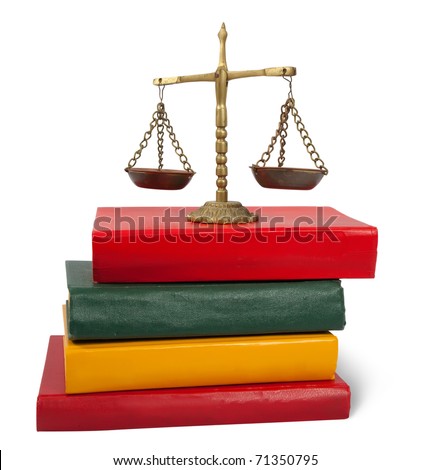   justice concept.  Scales of justice atop legal books. Isolated with clipping path over white background