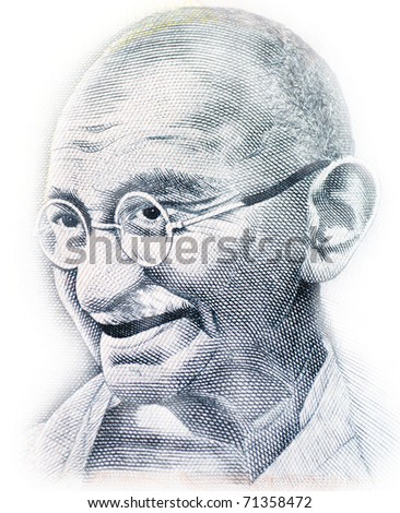 Close up shot of Gandhi on rupee note Royalty-Free Stock Photo #71358472