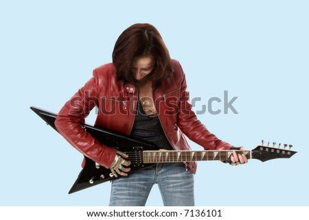 The girl with a black guitar in studio