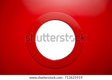 round white porthole in the red door.Copy space. Royalty-Free Stock Photo #713625919