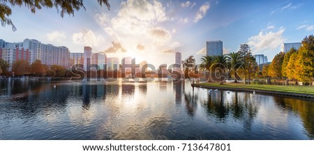 Sunset at Orlando in Lake Eola Park with water fountain and city skyline, Florida, USA Royalty-Free Stock Photo #713647801