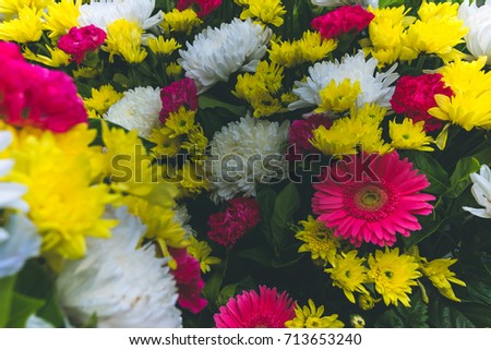 Flower arrangement of many colors together.