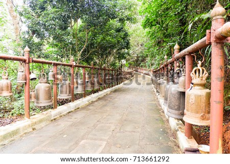 The pathway to the temple, lined with bells.