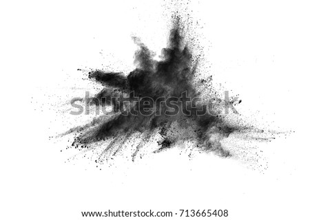Black powder explosion. Closeup of black dust particles explode isolated on white background. Royalty-Free Stock Photo #713665408