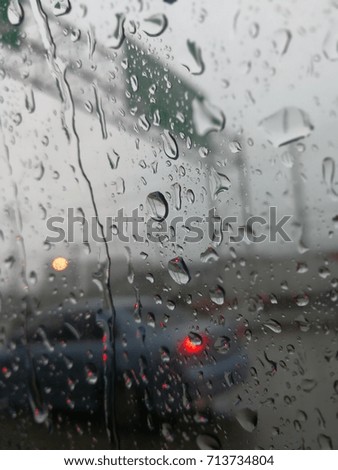 Rain drops with blurred traffic background