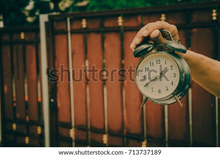 Antique clock in the old hand, the old and retro style  picture