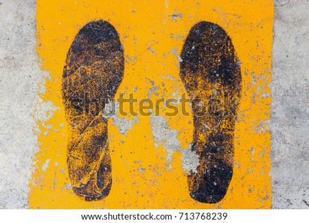 black footpath and yellow footpath on sidewalk cement background