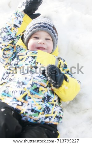 Little boy playing in the snow, portrait