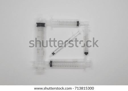 syringes in square