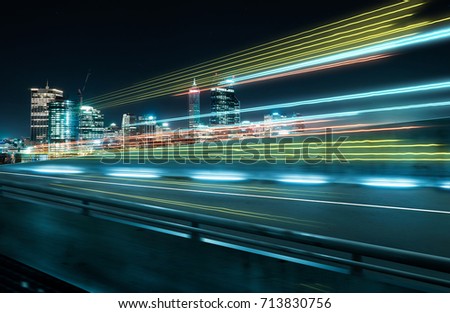 View from Side of flyover,blurred motion effect  with light trails and beautiful city skyline background . Royalty-Free Stock Photo #713830756