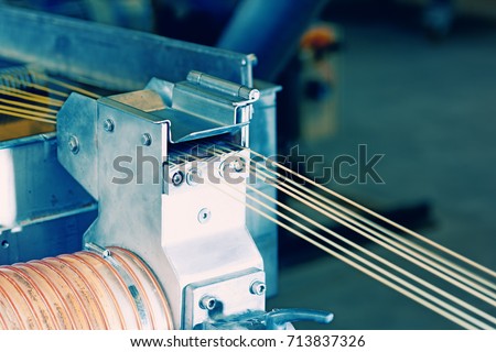 Machine with lines of synthetic fibers Royalty-Free Stock Photo #713837326