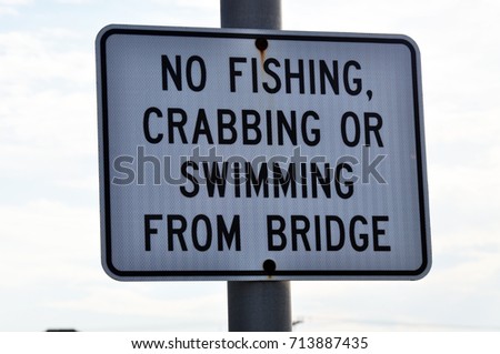 No Fishing, Crabbing, or Swimming From Bridge Sign

