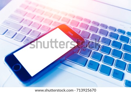 smartphone with laptop blue tech color tone