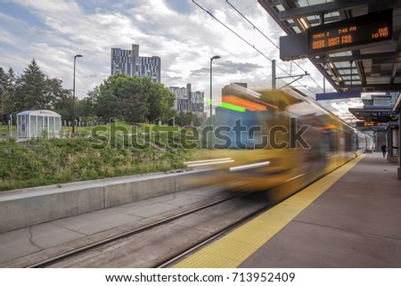 A Wide Angle Shot of a Lightrail Train Arriving at a Stop in Minneapolis on a Perfect Summer Afternoon