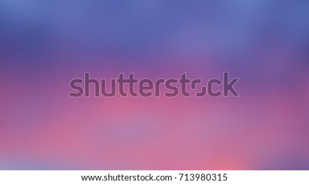 Blurred background of broad bands of blue and pink