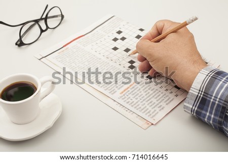 newspaper over table with coffee