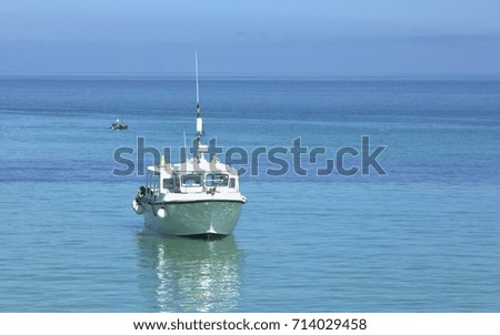 Boat on the blue sea.