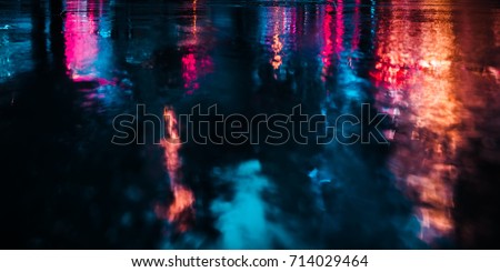 Lights and shadows of New York City. Soft focus image of NYC streets after rain with reflections on wet asphalt Royalty-Free Stock Photo #714029464