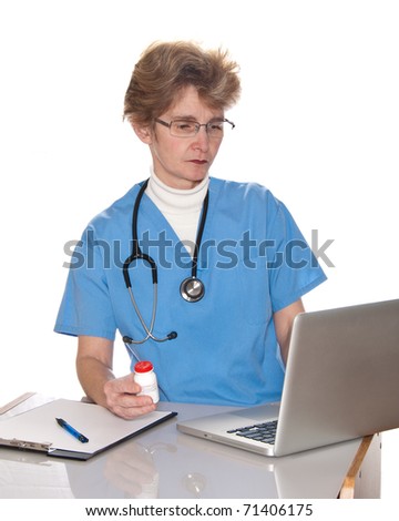 Female doctor prescribe medicine - at work use laptop