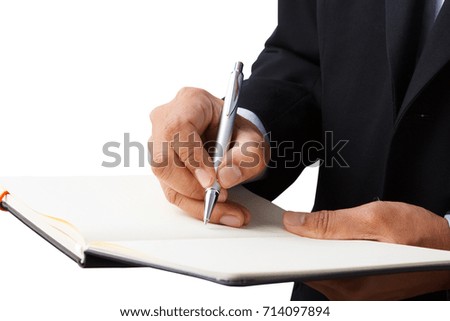 Businessman hand writing diary Isolated on white background