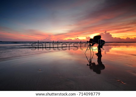 Silhoutte of a lone photographer at sunset