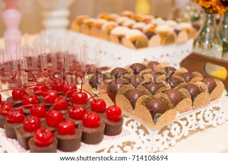 Horizontal picture of delicious chocolates with cherry and truffles for woman party