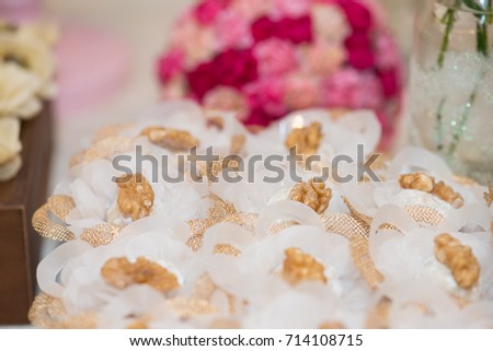Macro picture of ornated table with bonbon with chestnuts for woman party