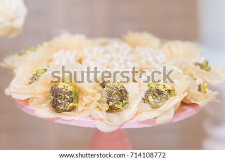 Horizontal picture of beautiful chocolate candy with peanuts for woman party